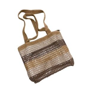 The Sak neutral stripe crochet over gold metallic shoulder bag top zipper